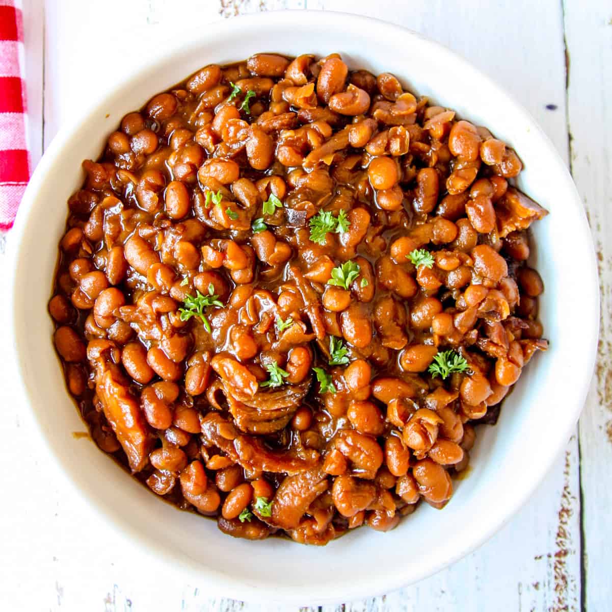 Slow Cooker Baked Beans in a white bowl.