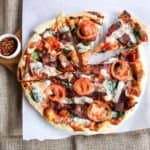 A pizza sitting on top of a table