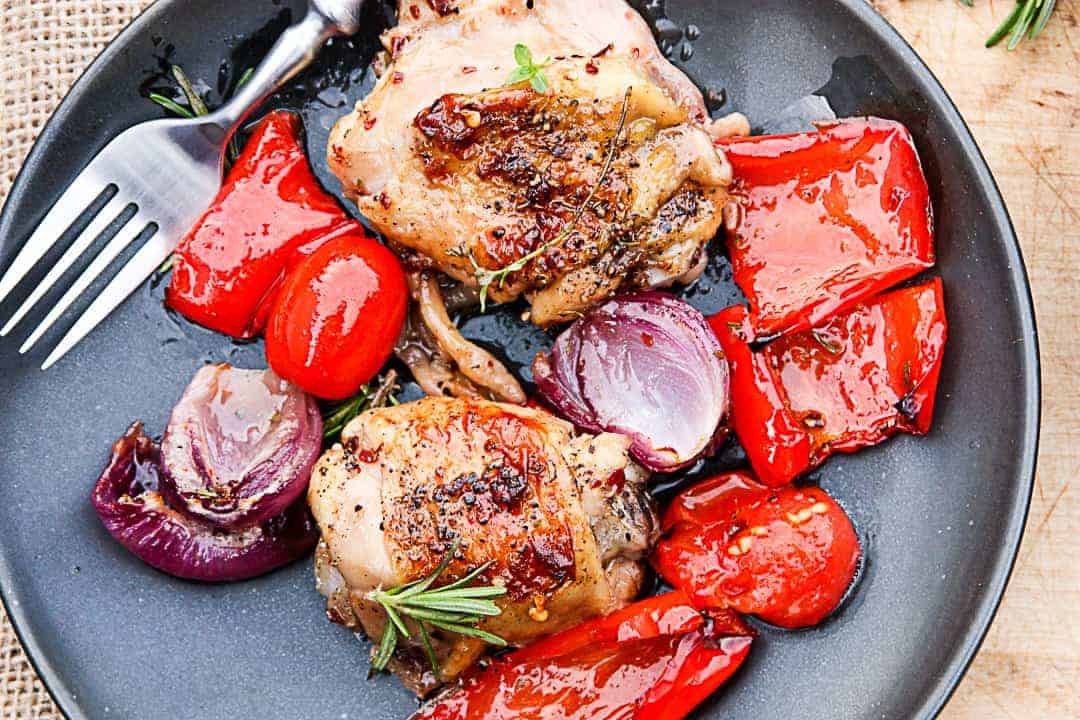 A plate of food, with Chicken and vegetables