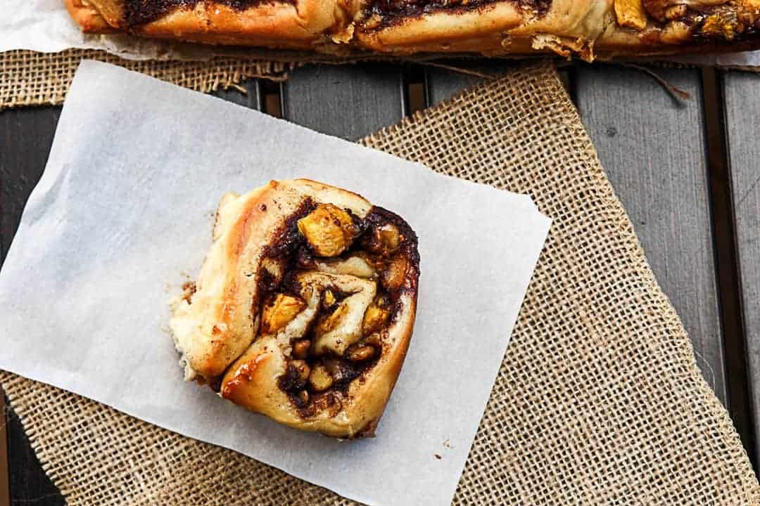 A sweet roll sitting on top of a table