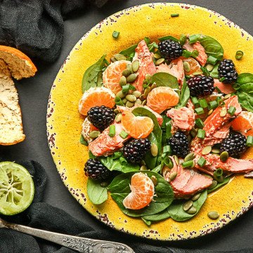 A plate of food, with Salad and Salmon