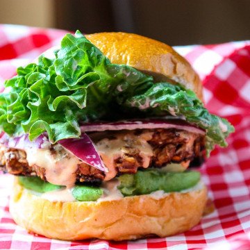 A hamburger sitting on top of a table