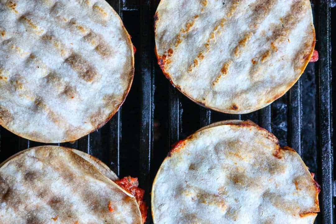 A close up of a tortillas on a grill