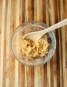 Ingredients being combined in a glass bowl.