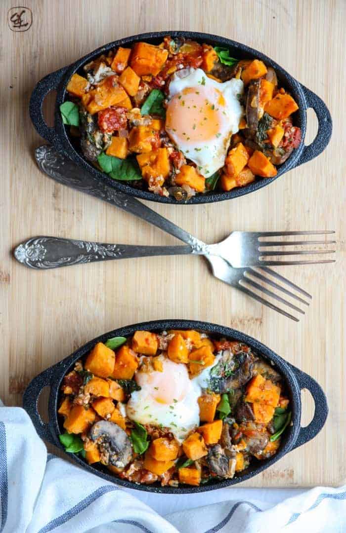 A plate of food with a fork and knife, with Sweet potato