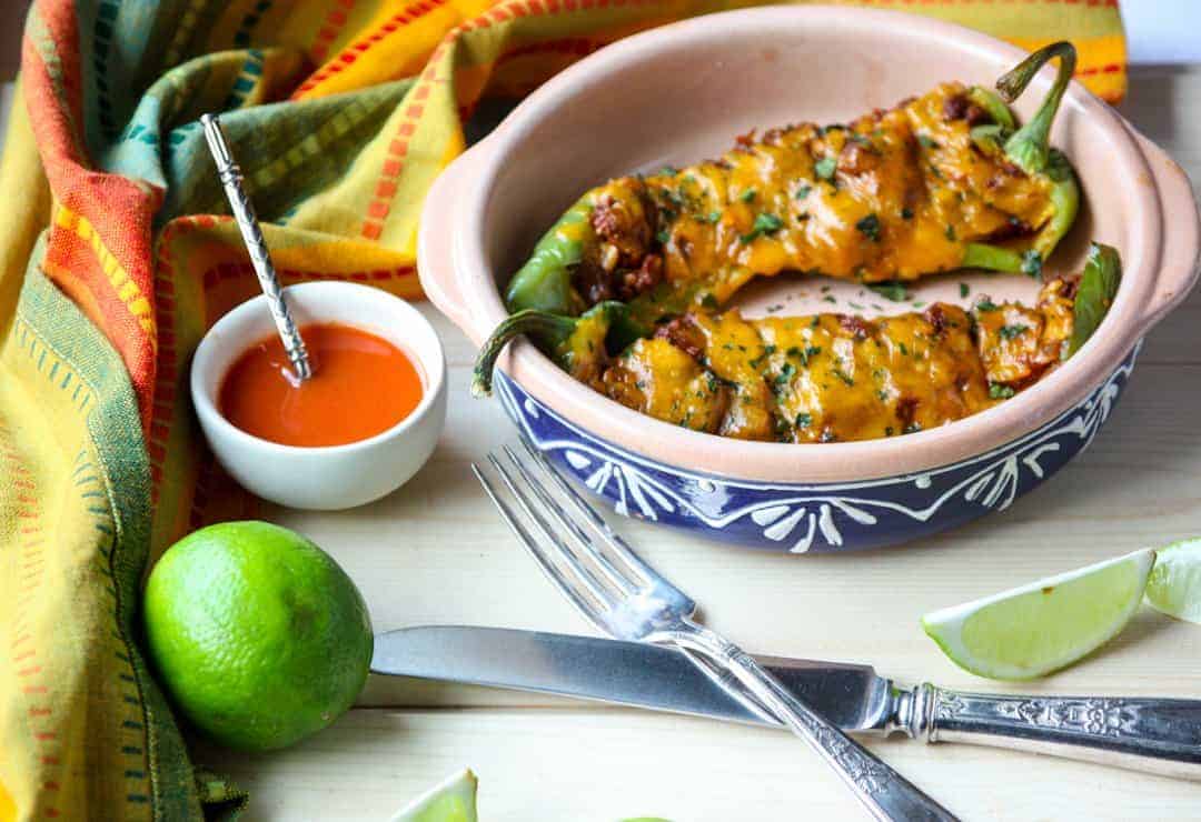 A bowl of food with a knife and fork