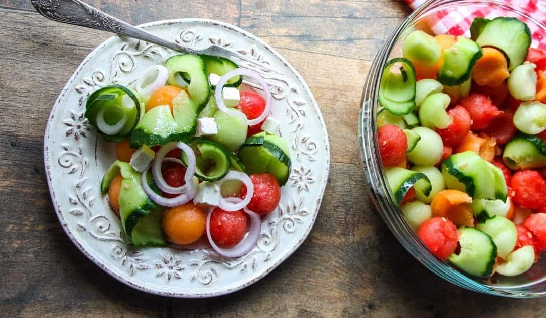 watermelon, honeydew, and cantalope salad with cucumbers, feta, and pickled onion.