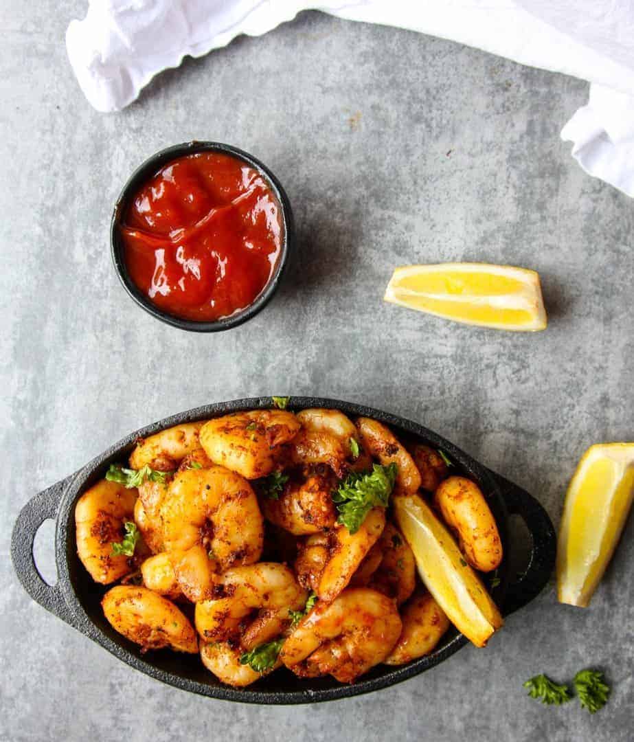 Cooked Shrimp in a cast iron pan.