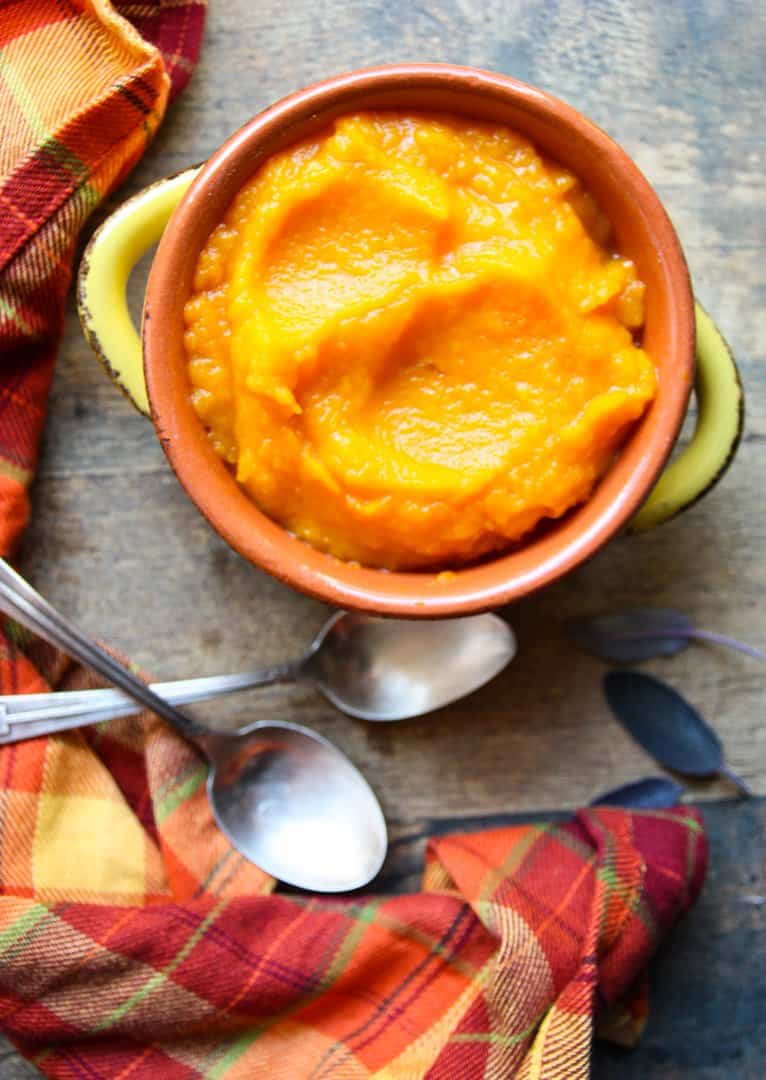 A serving dish of roasted garlic butternut squash puree