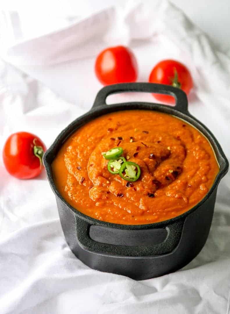Southwestern Pumpkin Soup in a black cast iron dutch oven.