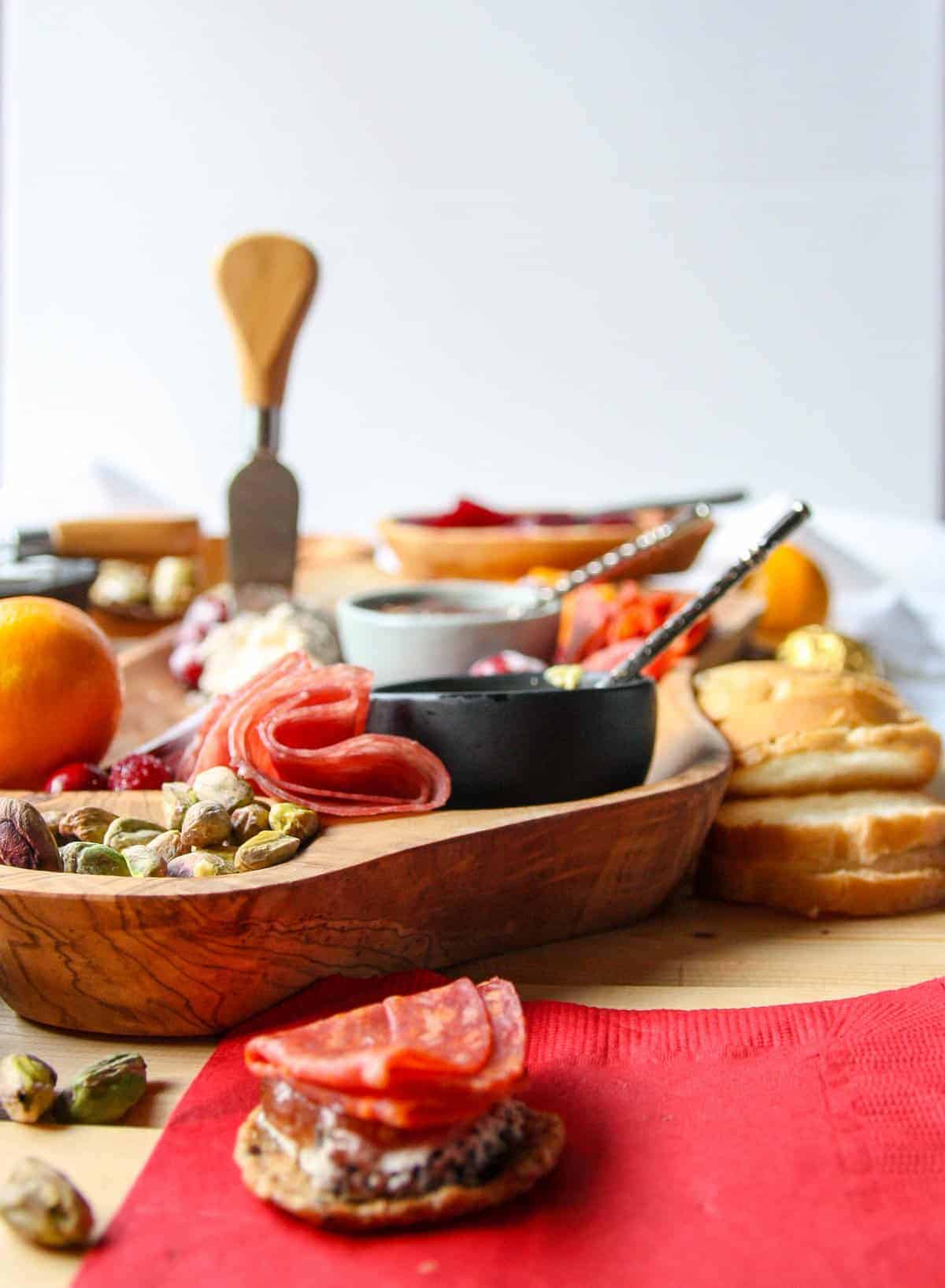 A holiday charcuterie board with meat, cheese, and fruit