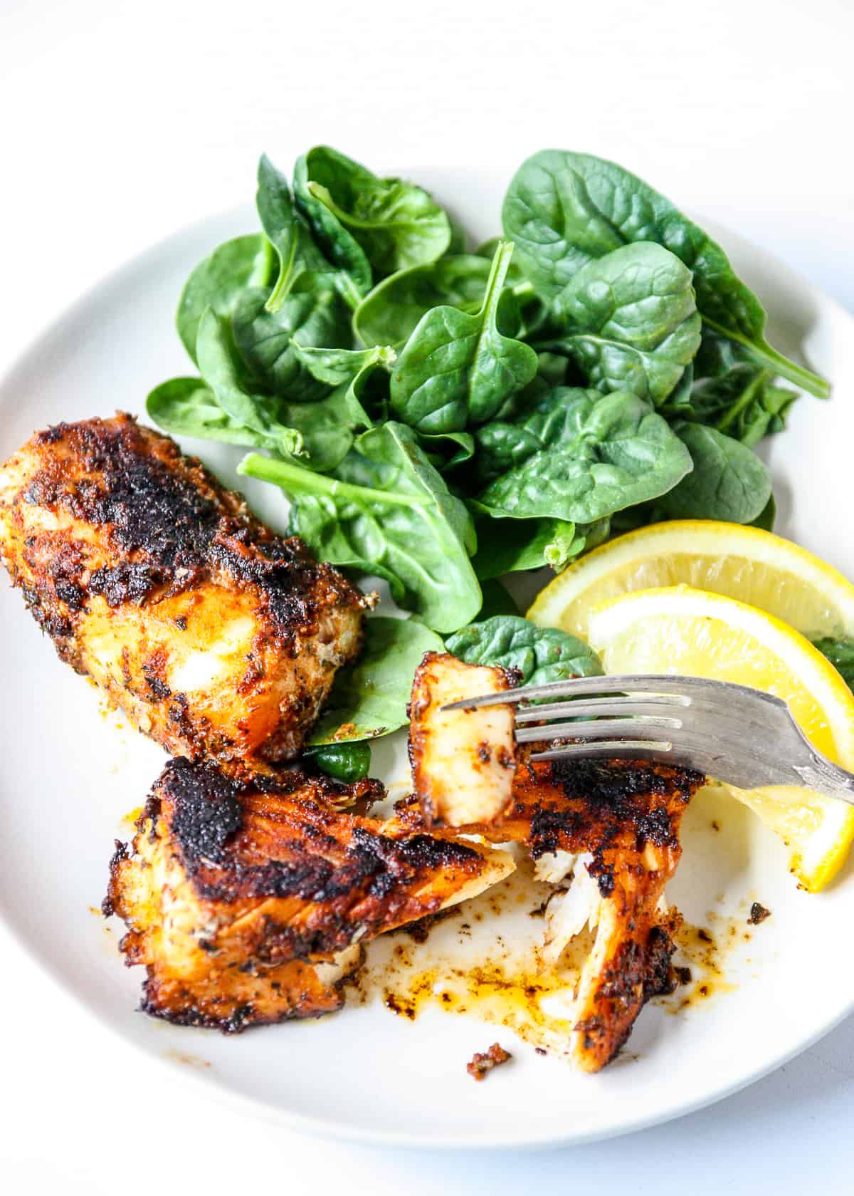 A piece of fish on a fork.