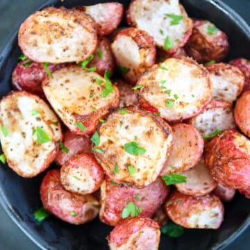 Air fried radishes in a black dish.