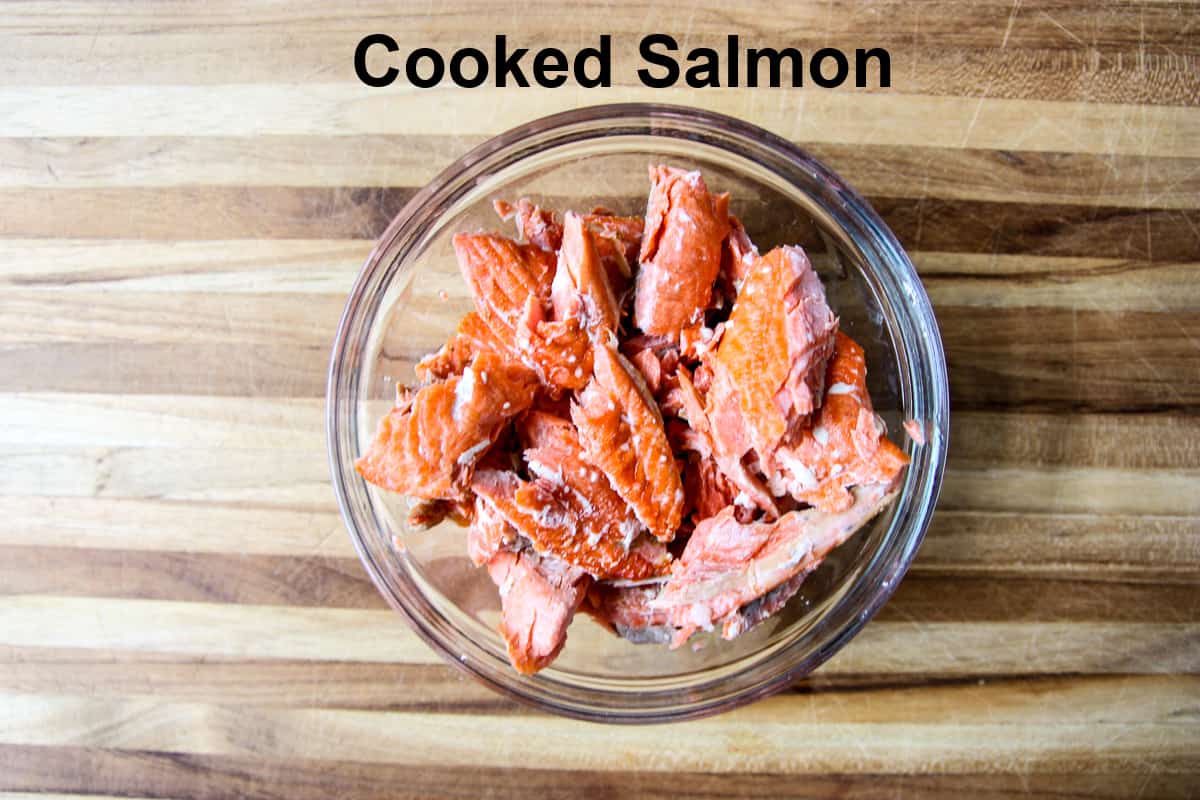 Chunks of cooked salmon in a glass dish.