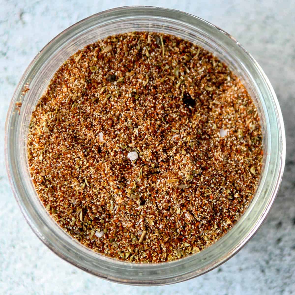 Chicken taco seasoning mix in a glass jar.