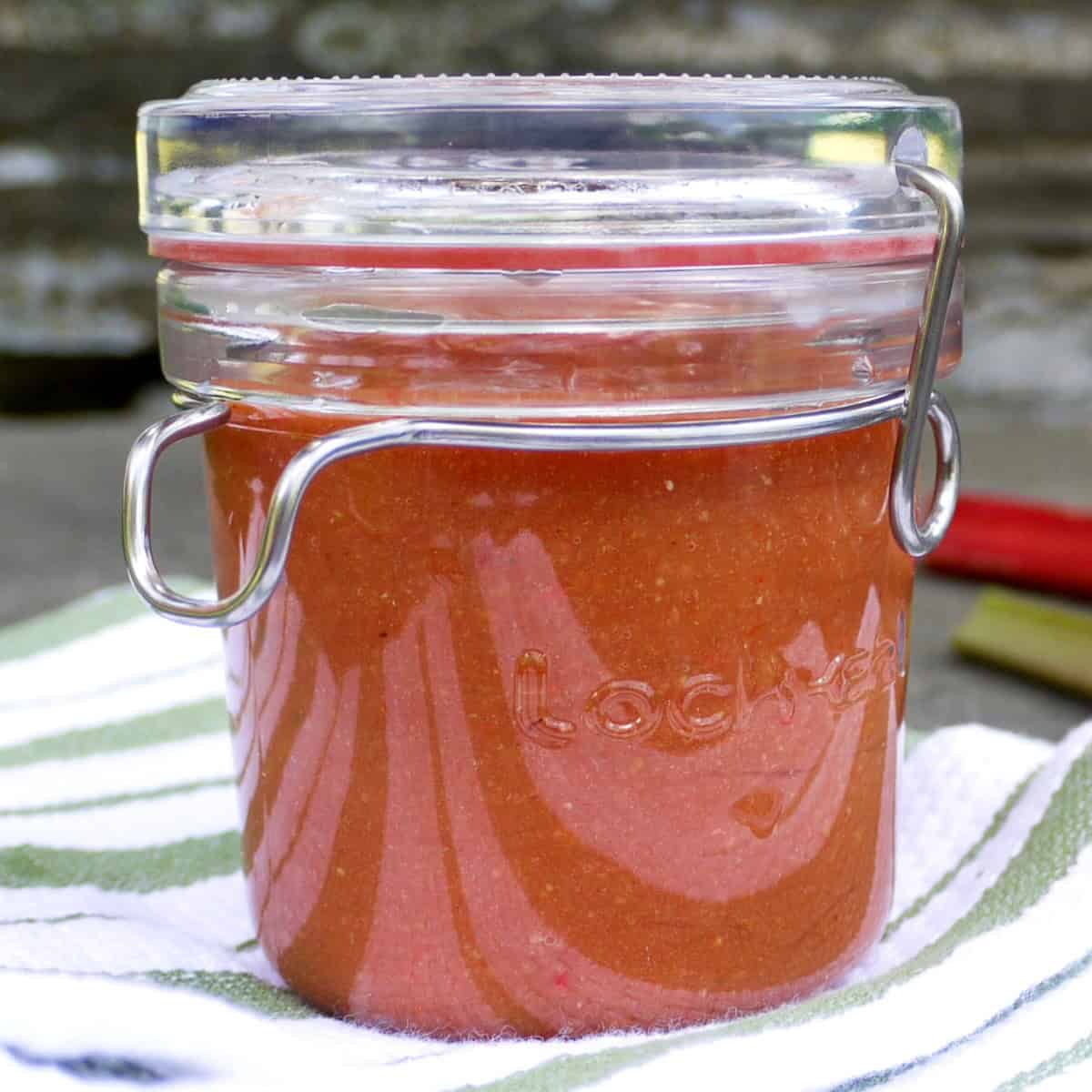 Rhubarb barbecue sauce in a glass jar.
