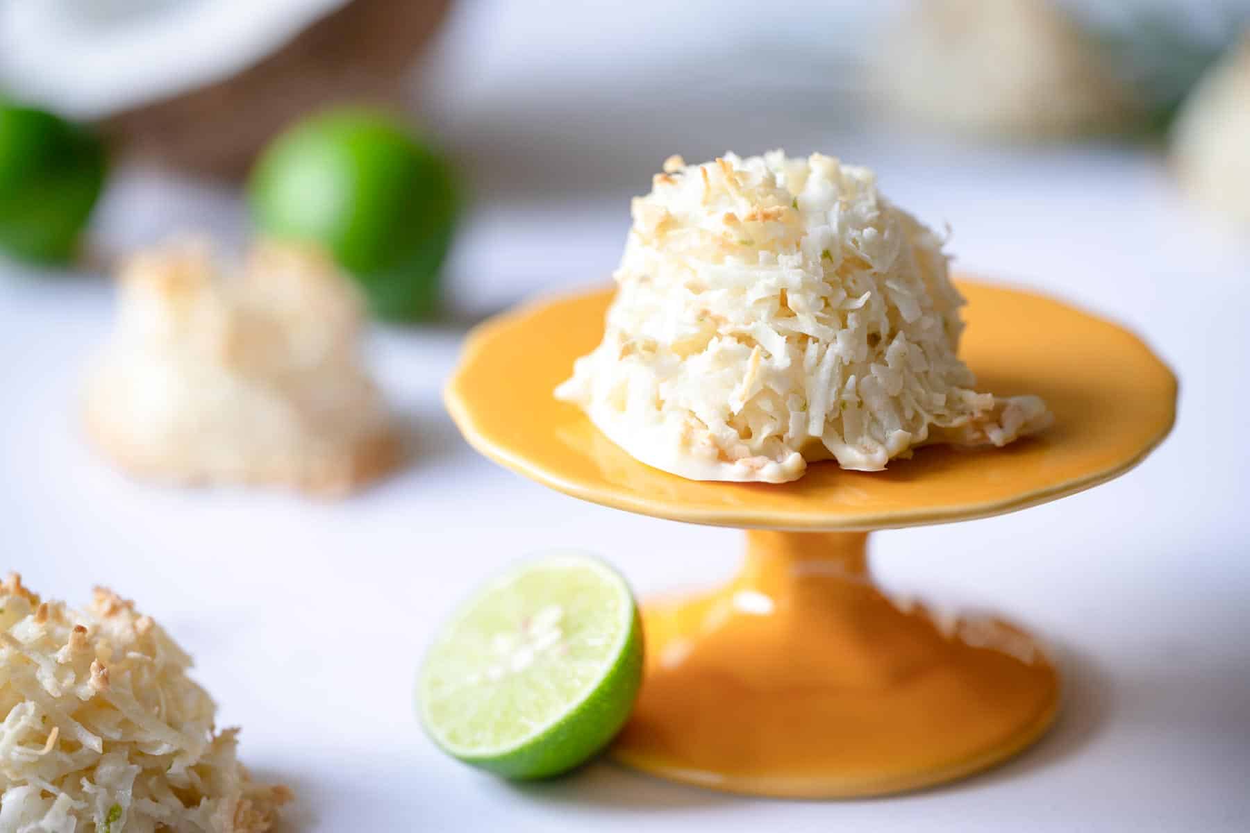 image of coconut macaroon on tiny yellow pastry stand