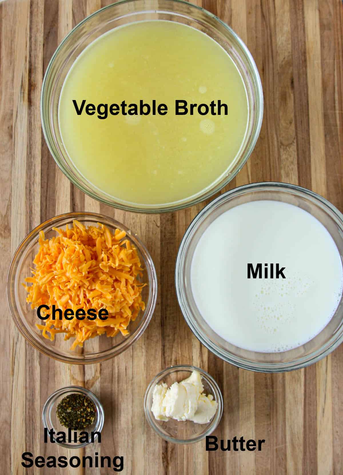 The remainder of the soup ingredients in glass bowls.