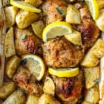 Baked Greek chicken and potatoes with lemon.