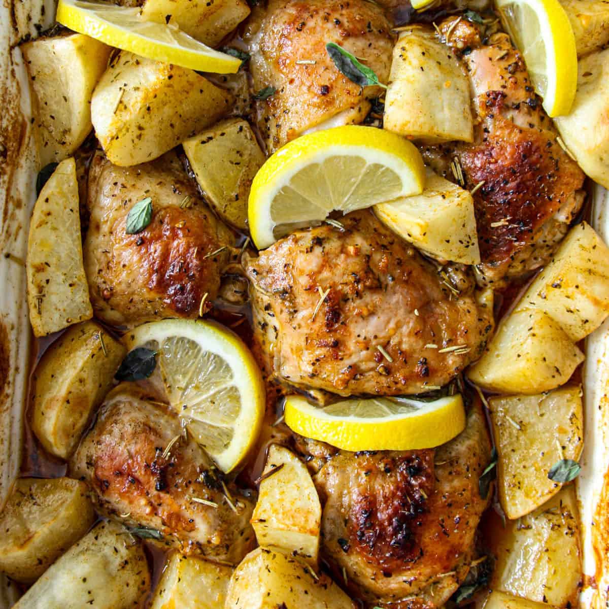Baked Greek chicken and potatoes with lemon.